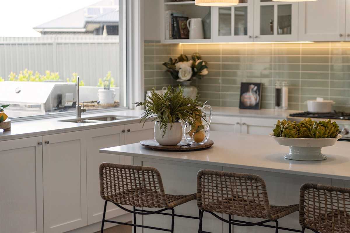 image upload c_limit,f_auto,w_1200 v1778652938 content-images acreage-house-designs acreage-kitchen