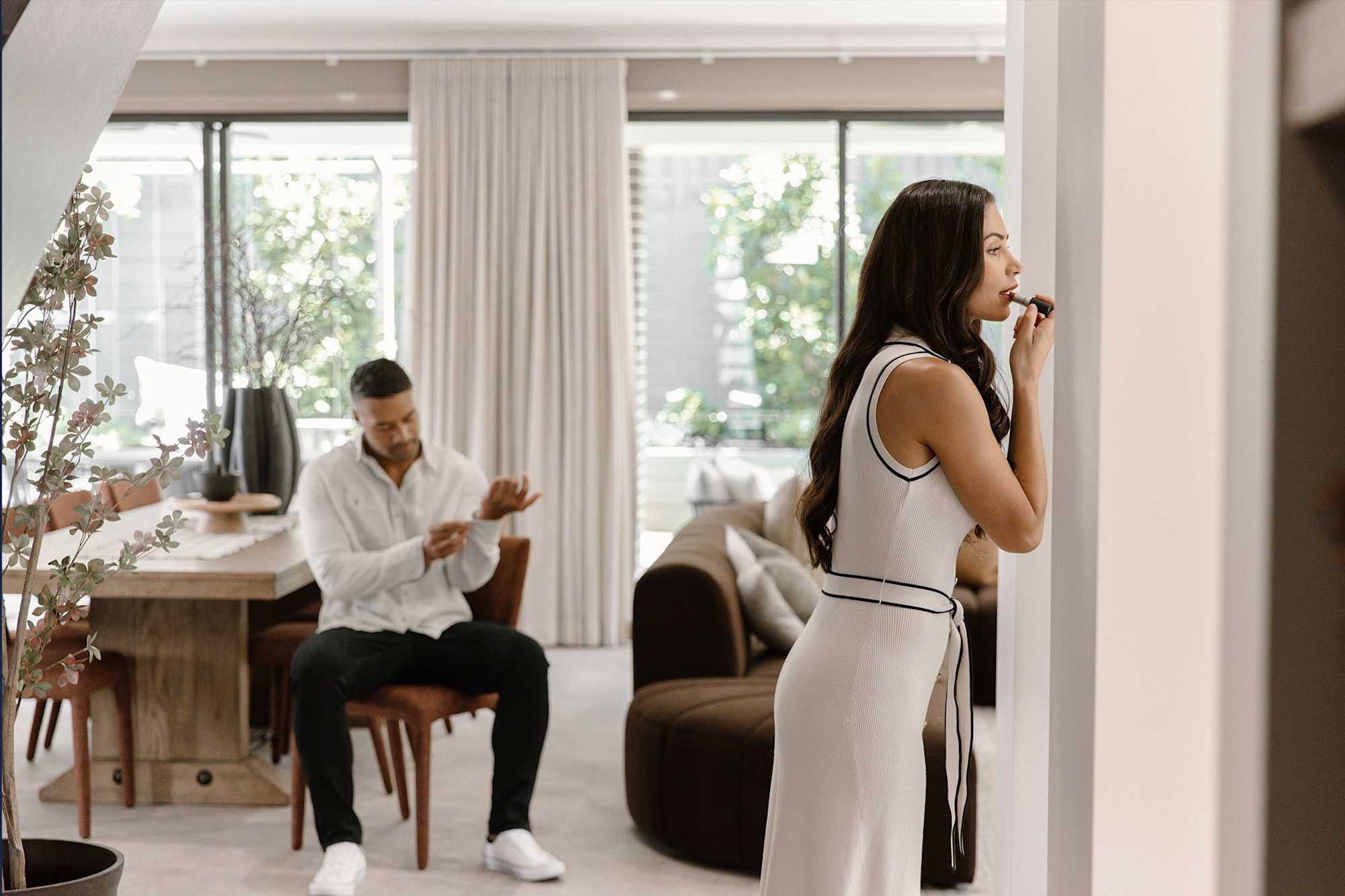 Young couple getting ready at home